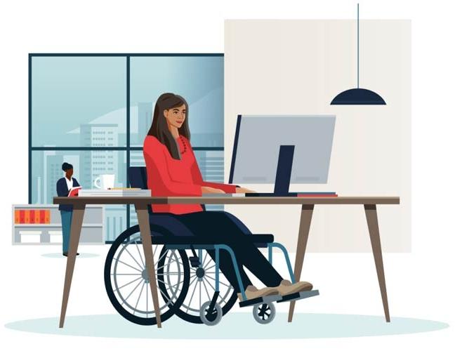 一位坐在轮椅上的女士专注于她在电脑前的工作，展现了她的决心.